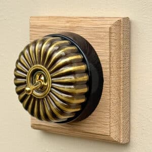 single period switch on a square oak pattress