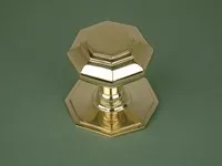 Polished cast brass octagonal door knob.